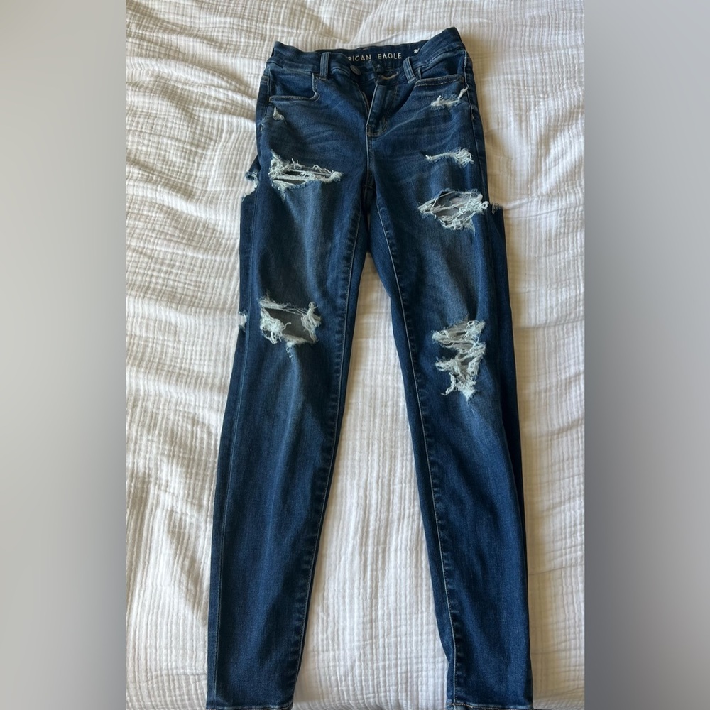 American Eagle next level stretch size 0 ripped dark blue jeans